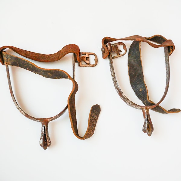 Set of antique metal  riding boots horse spurs  with natural leather strap, original rustic patina
