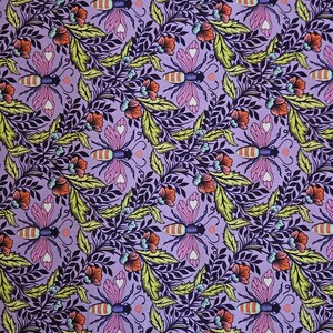 May include: A fabric with a repeating pattern of stylized bees, flowers, and foliage in shades of purple, pink, orange, yellow, and dark blue. The design features heart-shaped details on the bees and flowers. The fabric is measured with a tape measure.