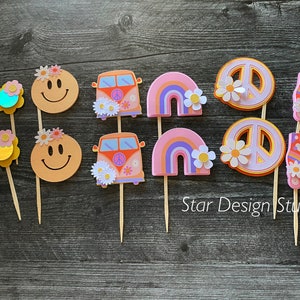 May include: A set of 10 colorful cupcake toppers featuring peace signs, smiley faces, rainbow arches, a vintage van, and roller skates. The toppers are perfect for a 70s themed party.
