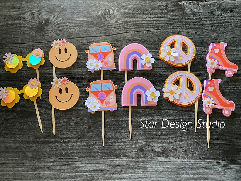 May include: A set of 10 colorful cupcake toppers featuring peace signs, smiley faces, rainbow arches, a vintage van, and roller skates. The toppers are perfect for a 70s themed party.