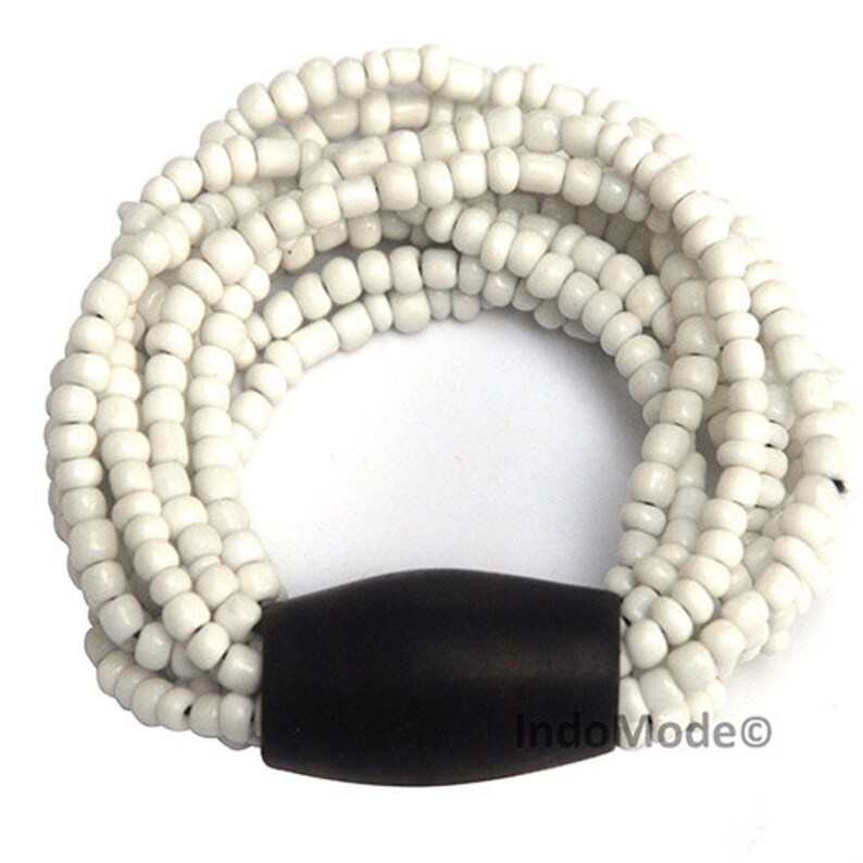 Handmade Bali bracelet for women. They have 11 elastic strands for easy fit. Made with glass beads with one wood large bead.