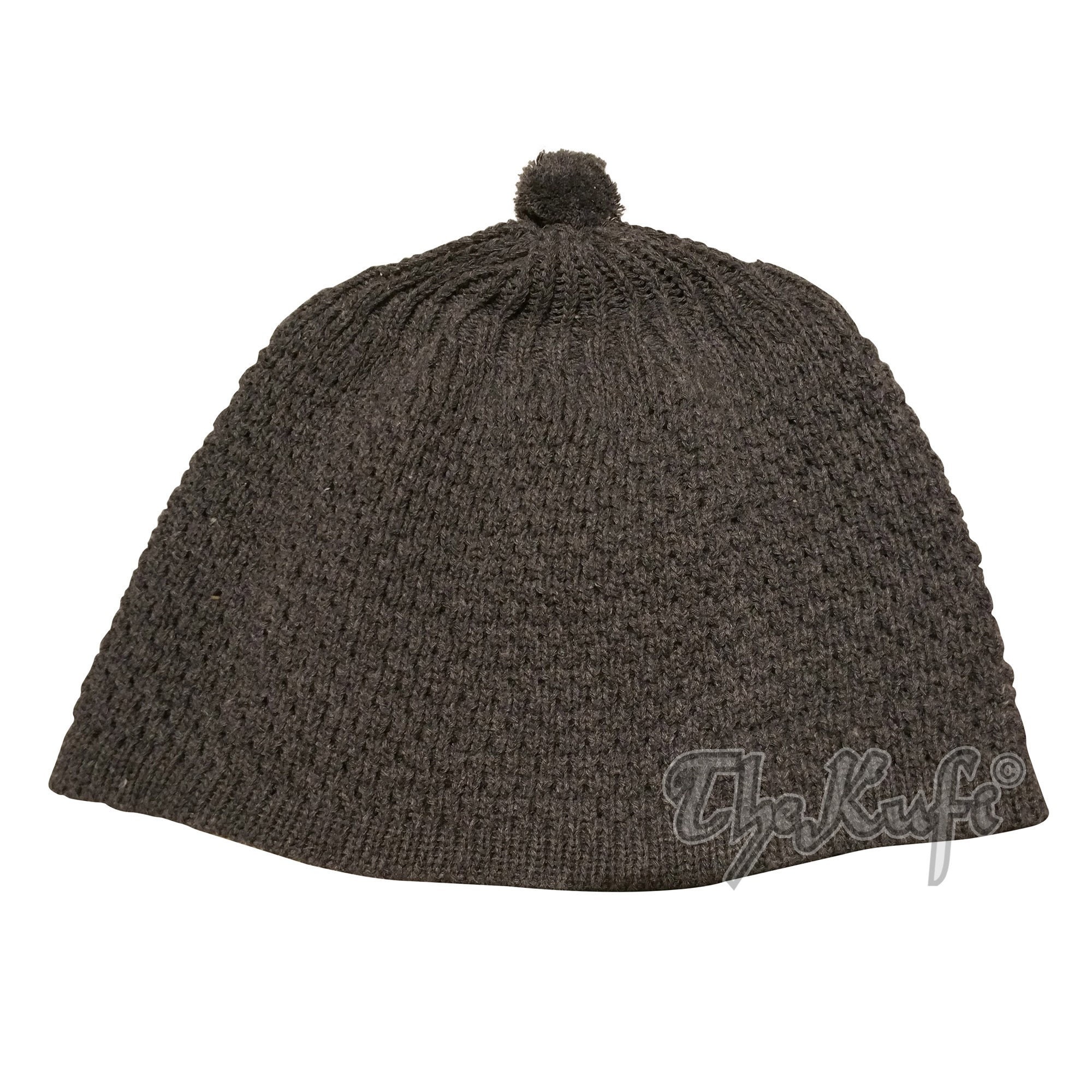 black beanie with ball on top