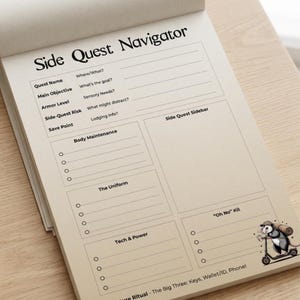 May include: A notepad with the title "Side Quest Navigator" in black font. The notepad has sections for quest details, body maintenance, and a sidebar. A cartoon opossum on a scooter is in the lower right corner. The notepad is on a light wood surface.