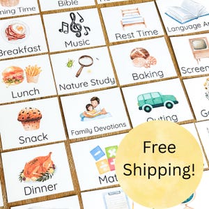 May include: A collection of illustrated cards featuring various daily activities. The cards depict images such as breakfast, music notes, rest time, lunch, nature study, baking, snack, family devotions, outing, and dinner. The cards are arranged on a wooden surface.