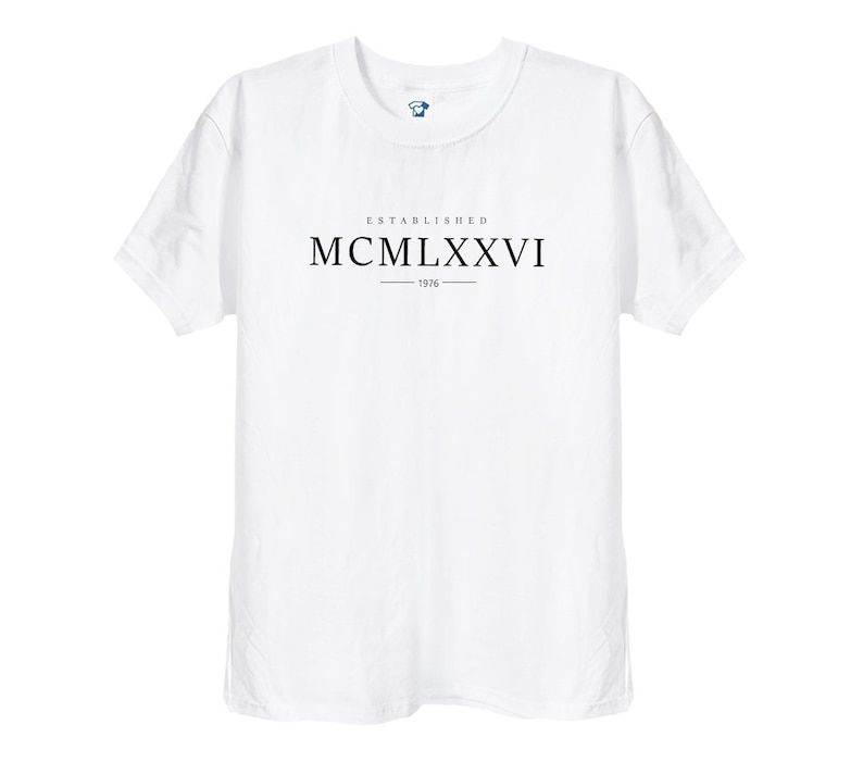 May include: White t-shirt with black text that reads "ESTABLISHED MCM LXXVI - 1976"