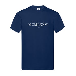 May include: A navy blue t-shirt with white text that reads "ESTABLISHED MCMILXXVI 1976".
