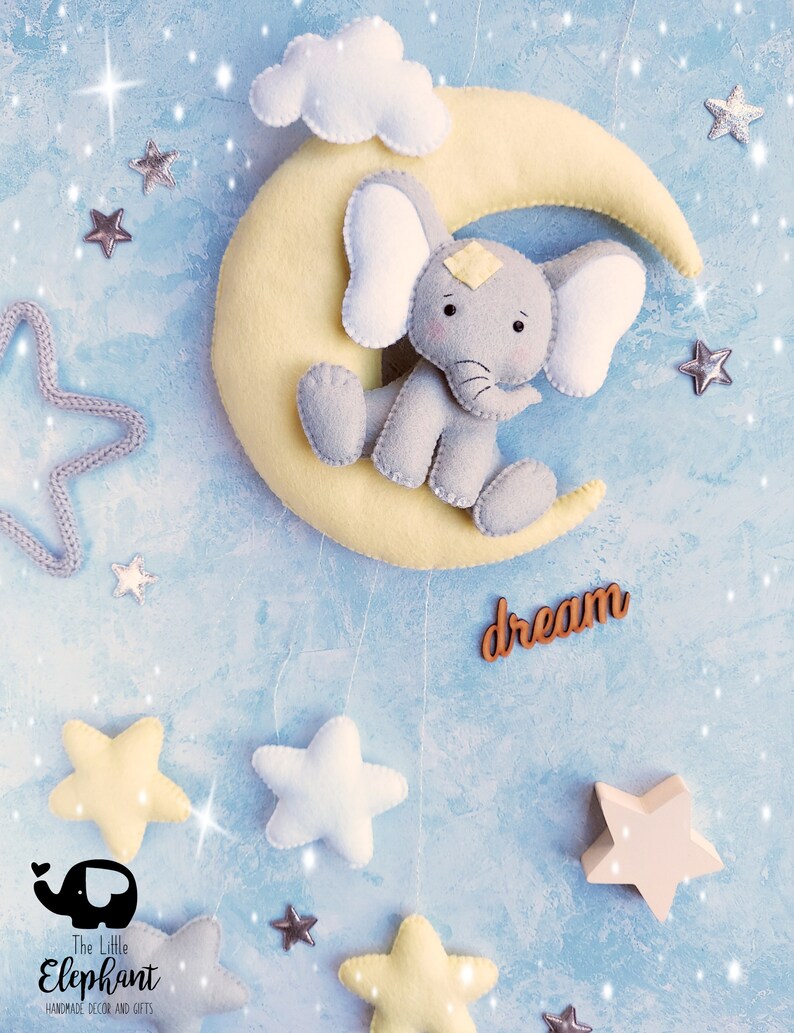 Elephant sitting on pale yellow moon, nursery wall hanging