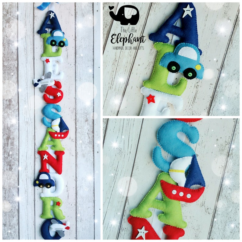 May include: A felt letter banner with the name "ALEXANDER" in green, blue, red, and white letters. Each letter has a small felt appliqu&eacute; of a car, airplane, or sailboat.