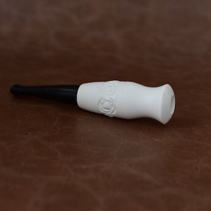 white cigarette holder $15 Large Meerschaum Holder, Assort Solid brass with 925 sterling silver plating Carabiner clip for easy attachment Holds up to king size joints Latch mechanism on lid to securely lock Sold at Auction: Antique Ivory