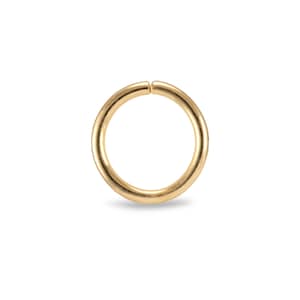May include: A gold-coloured metal ring, also known as a jump ring, is a common jewellery finding used for connecting chains, charms, and other jewellery components.
