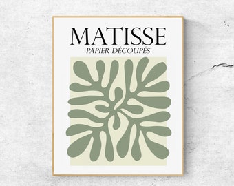 May include: A framed print with the text "MATISSE PAPIER DÉCOUPÉS" and a green abstract design.