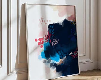 May include: A square framed wall art piece featuring an abstract composition. The design includes bold patches of deep navy blue, bright cyan, and soft pink brushstrokes on a white background, accented by small dots and thin red lines.
