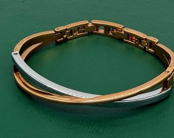 Vintage Anne Klein Two Tone Crossover Bracelet Gold Silver Hinged Bangle Signed Lion Logo Modernist Statement Designer Jewelry 1980s 1990s