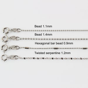 May include: Four different types of silver chains with clasps. The chains are labelled with their names and sizes: Bead 1.1mm, Bead 1.4mm, Hexagonal bar bead 0.9mm, Twisted serpentine 1.2mm.