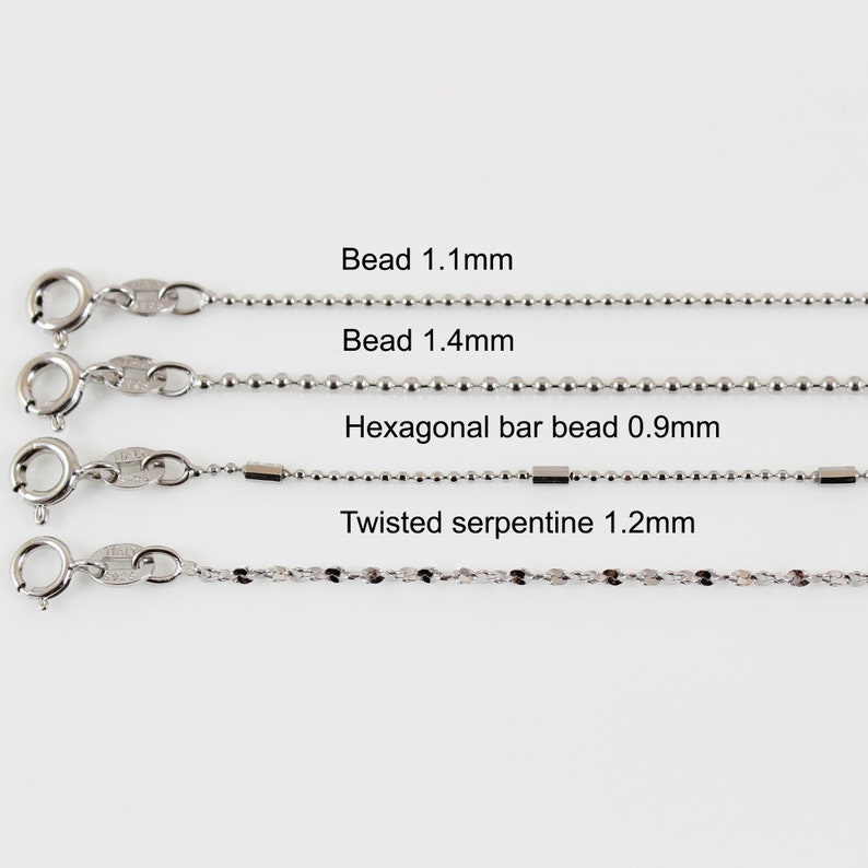 May include: Four different types of silver chains with clasps. The chains are labelled with their names and sizes: Bead 1.1mm, Bead 1.4mm, Hexagonal bar bead 0.9mm, Twisted serpentine 1.2mm.