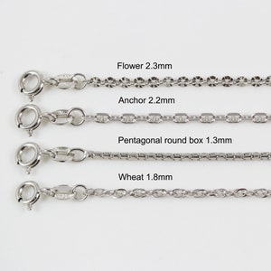 May include: Four different types of silver chains, each with a different link style and size. The chains are labelled "Flower 2.3mm", "Anchor 2.2mm", "Pentagonal round box 1.3mm", and "Wheat 1.8mm".