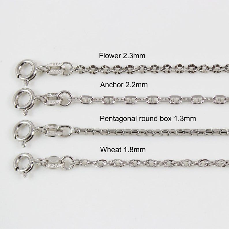 May include: Four different types of silver chains, each with a different link style and size. The chains are labelled "Flower 2.3mm", "Anchor 2.2mm", "Pentagonal round box 1.3mm", and "Wheat 1.8mm".