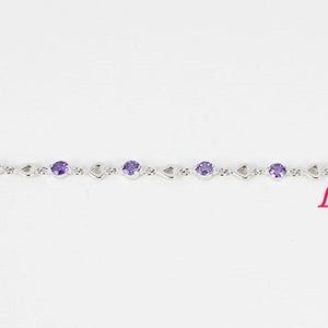 May include: A silver bracelet with a chain link design and purple gemstones. Lark King is printed in red on the bottom right corner of the image.