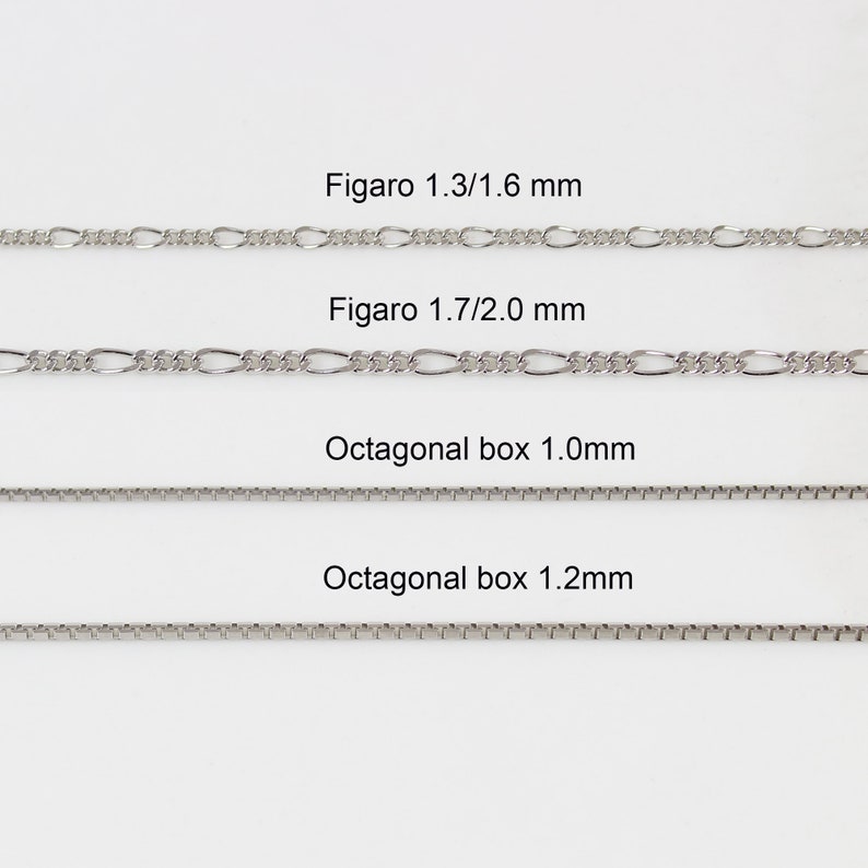 May include: Four silver chains of different styles and sizes. The chains are labelled "Figaro 1.3/1.6 mm", "Figaro 1.7/2.0 mm", "Octagonal box 1.0mm", and "Octagonal box 1.2mm".