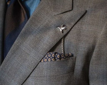 The Silver "Hummingbird" Lapel Chain or Boutonniere Made by Spero Accessories for the lapel of your Suit Modeled by Daniel Messana