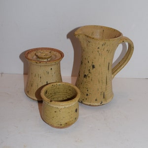 3 Piece set of 1970&#39;s Creamer / Pitcher, Covered Stoneware Sugar Jar and open Container by Susan Limmer, Cortland, New York, Sold as a set