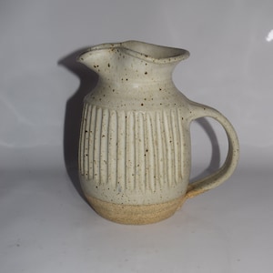 Wheel thrown  Off White Handcrafted Stoneware Carved Grooved Exterior Pitcher Studio Art Pottery Ribbed Textured Neutral Pitcher Signed