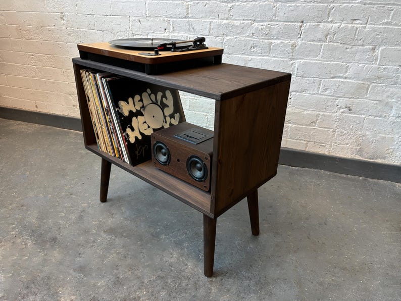 70 cm wide mid century style wooden record player stand in a dark finish.