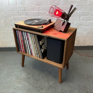 70 cm wide mid century style wooden record player stand in a medium finish.
