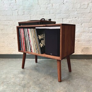 70 cm wide mid century style wooden record player stand in a cherry finish.
