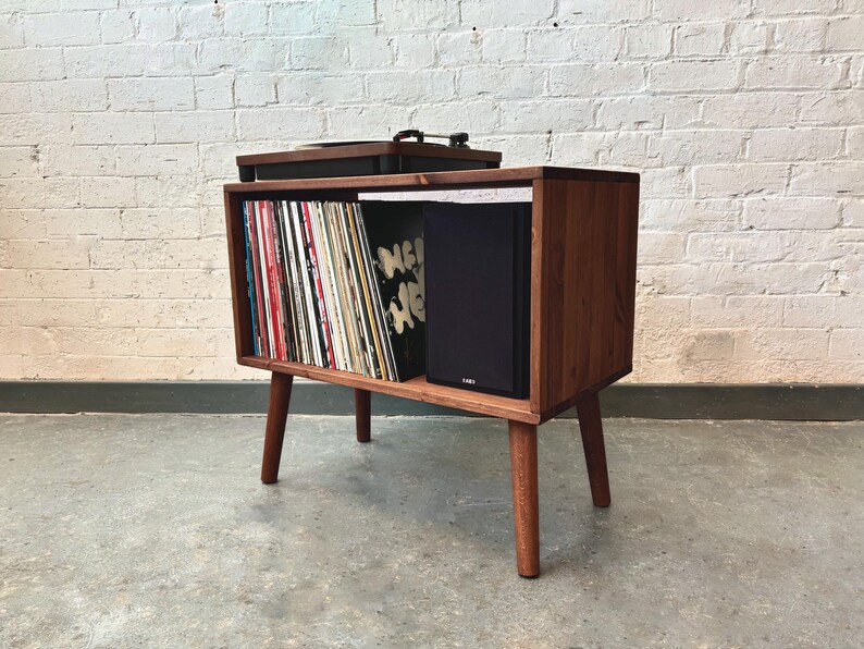 70 cm wide mid century style wooden record player stand in a cherry finish.