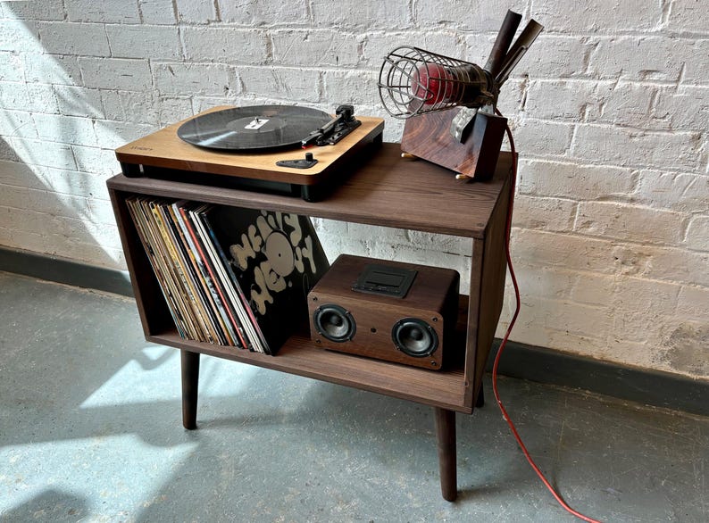 70 cm wide mid century style wooden record player stand in a dark finish.