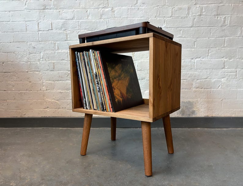 50 cm wide mid century style wooden record player stand in a medium finish.