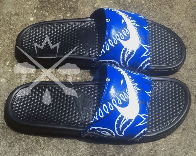 blue and gold nike slides