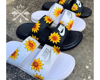 white nike slides with sunflowers