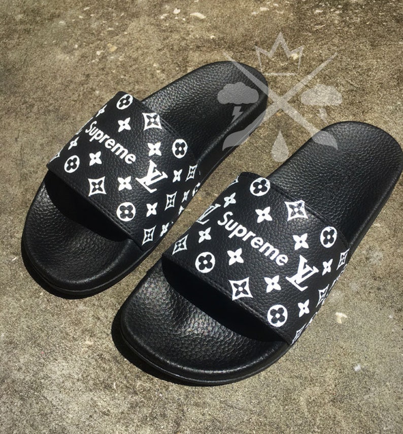 supreme flip flops white