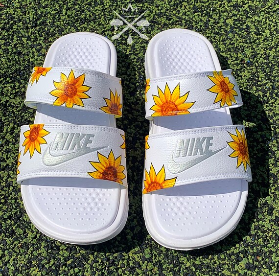 white nike sandals with sunflowers