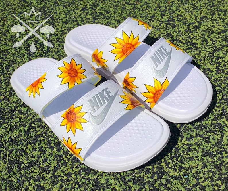 white nike sandals with sunflowers