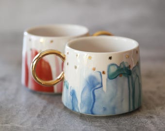 Anthropologie Night Sky Blue and Pink with Gold Mugs