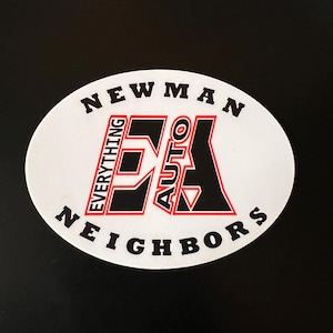 May include: White circle sticker with black text that reads "Newman Everything Auto Neighbors" and a black and red logo in the center.