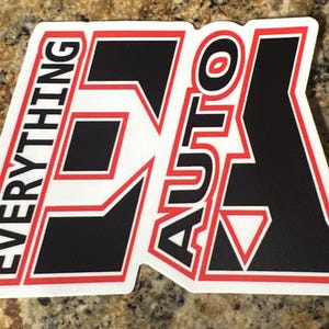 May include: A white sticker with a black and red logo that says "Everything Auto". The logo is stylized with a large "E" that has a red outline.