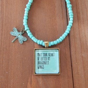 Beaded Pendant Necklace with Dragonfly Charm. Aqua beads. May your heart be lifted by dragonfly wings.