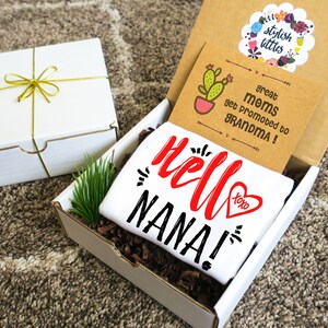 Pregnancy Announcement Onesie ® Gift Box a Hello Nana Love Heart Baby Reveal to Parents Grandparents Grandma Abuela Mimi Nonna Gigi