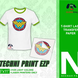 May include: A white t-shirt with a green ringer and a Wonder Woman logo printed on the front. The t-shirt is next to a sheet of 8.5" x 11" white laser transfer paper with a Wonder Woman logo printed on it. The text "TECHNI PRINT EZP" is printed in green below the paper. The text "FOR LIGHT COLORS" and "LASER PRINTERS ONLY" are printed in black below the paper. The text "T-SHIRT LASER TRANSFER PAPER" is printed in white on a green background. The text "NEENAH PAPER" is printed in white on a green background below a large white "N".