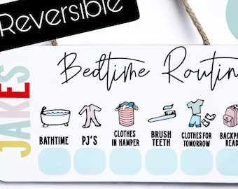 May include: A white wooden sign with the text "Bedtime Routine" and a series of icons representing bedtime activities, such as bath time, pajamas, brushing teeth, and reading. The sign is reversible and has a blue and white color scheme.