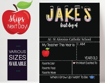 May include: Black chalkboard style printable sign with the text "JAKE'S first day of" at the top. The sign is decorated with a pencil design and has spaces to fill in information about the child's first day of school, including their age, favorite color, favorite food, favorite movie, and what they want to be when they grow up.