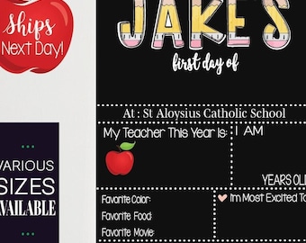 May include: A black chalkboard with the text "JAKE'S first day of" and a red apple graphic. The chalkboard also includes the text "At: St Aloysius Catholic School", "My Teacher This Year Is: AM", "Favorite Color:", "Favorite Food:", "Favorite Movie:", "YEARS OLD", "I'm Most Excited To", and "When I Grow Up I Want To Be".