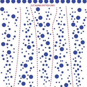 May include: A white sheet featuring a pattern of blue circles of varying sizes. The top section displays two horizontal rows of dots. Below, the text CUT ALONG DOTTED LINES appears above four vertical red dashed lines that divide the sheet into sections.
