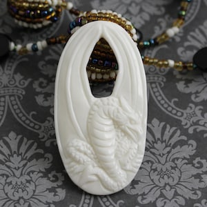 Mythical Dragon Pendant: Elegant Bone Carving for Necklace Design, 53mm