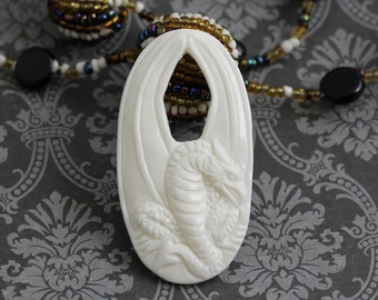 Mythical Dragon Pendant: Elegant Bone Carving for Necklace Design • 53mm