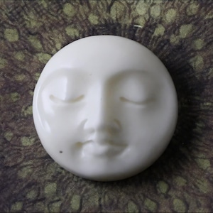 Hand Carved Bone Sleeping Moon Pendant: Celestial Jewelry Charm